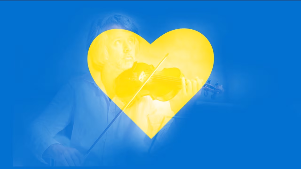 Gele hartvorm met wazige vioolmuzikant symboliseert muzikale hartenkreet voor Oekraïne benefietconcert in Enschede